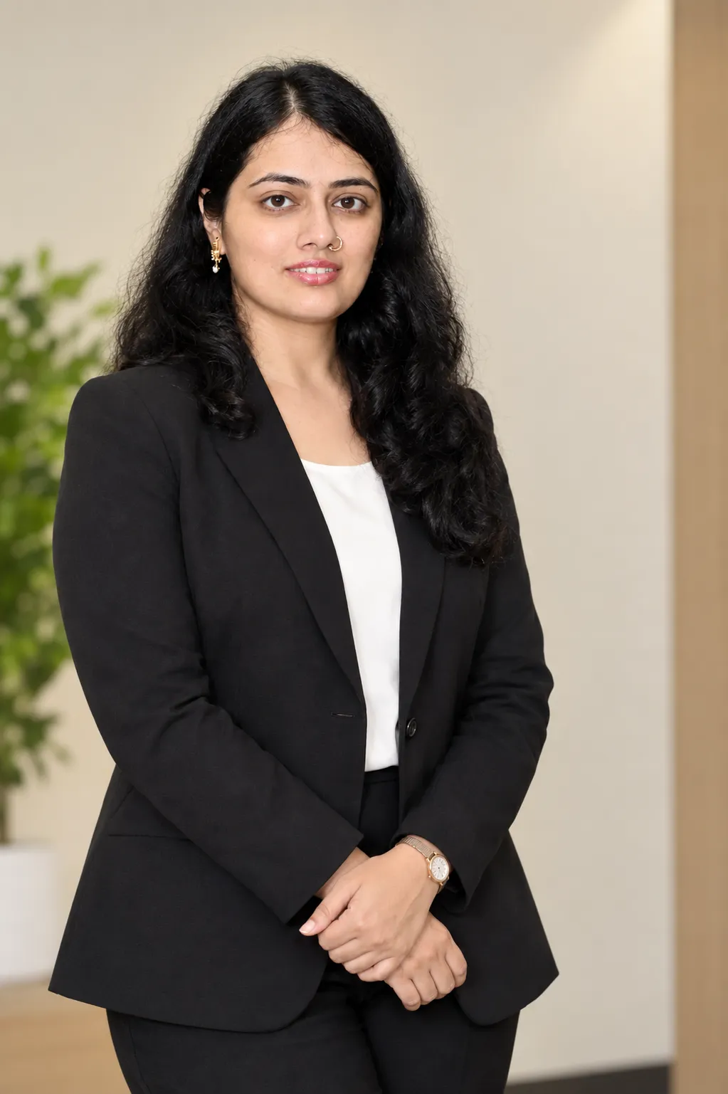 Professional, approachable founder portrait in a calm natural-light workspace; this is a placeholder to be replaced with the founder's own photo.